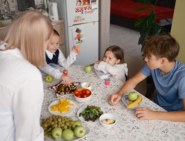Image of a young family at the breakfast table